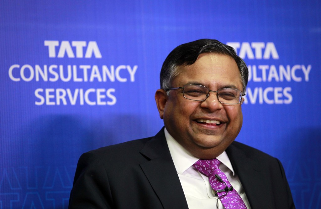 Chandrasekaran, chief executive officer of TCS, laughs while interacting with reporters during a news conference in Mumbai